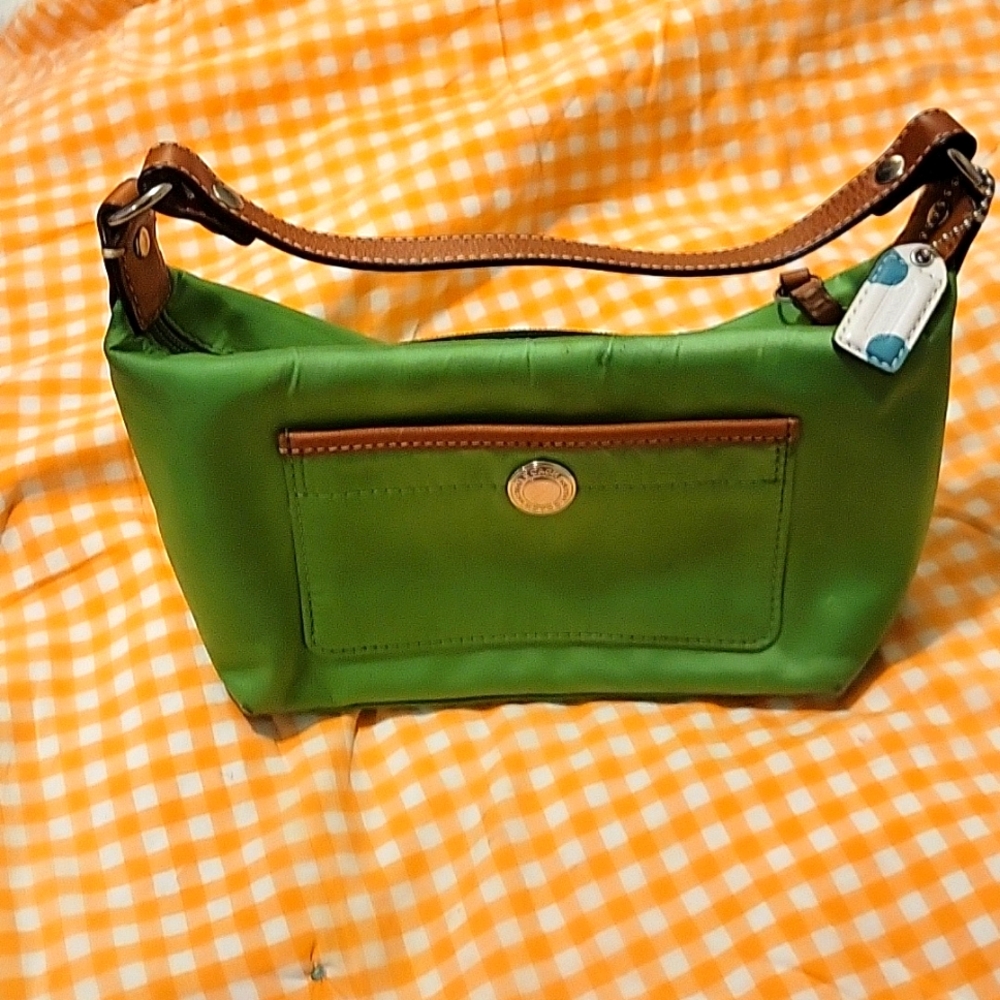 Darling lime green mini bag by coach..very gently used.
